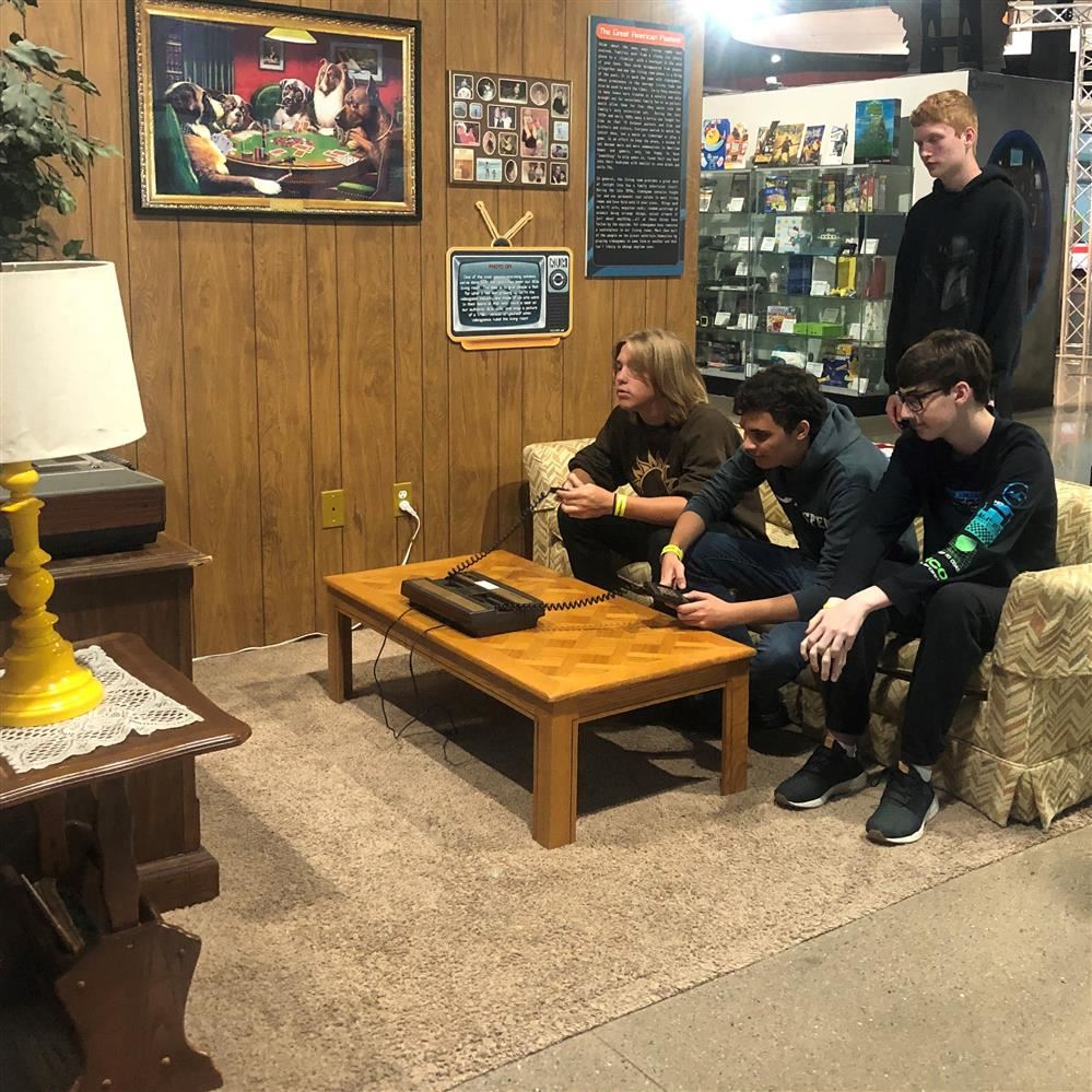 old living room with students playing video games